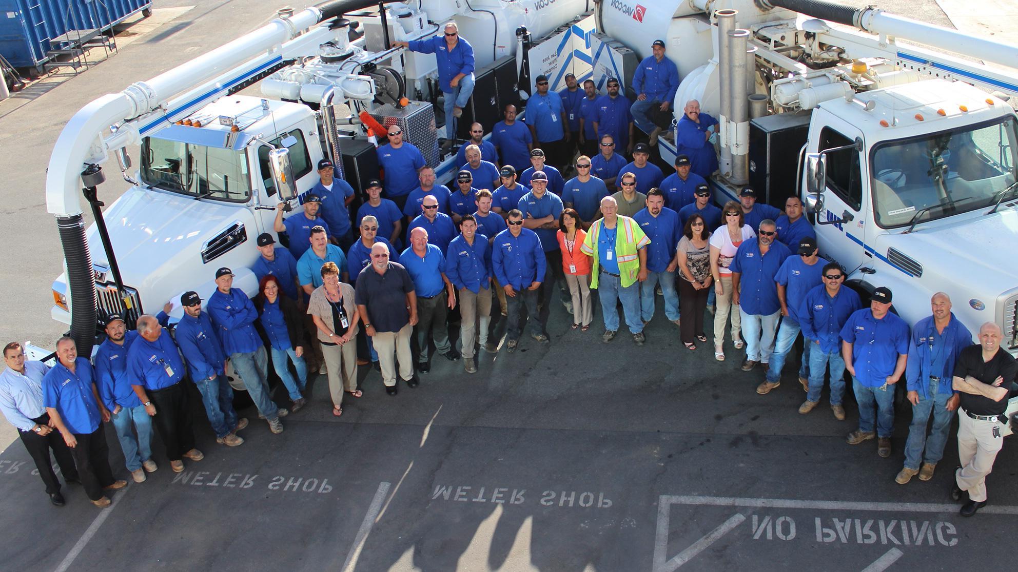 Diverse San Jose Water employees stand outside together